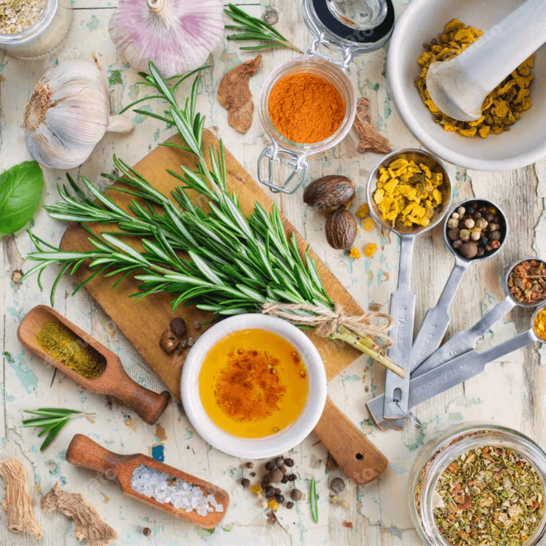 Herbs and natural healing ingredients arranged on a light surface